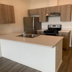 the kitchen in a B1 unit at Midtown Club Suites in Abbotsford rentals