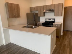 the kitchen in a B1 unit at Midtown Club Suites in Abbotsford rentals