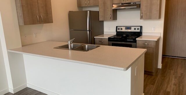 the kitchen in a B1 unit at Midtown Club Suites in Abbotsford rentals